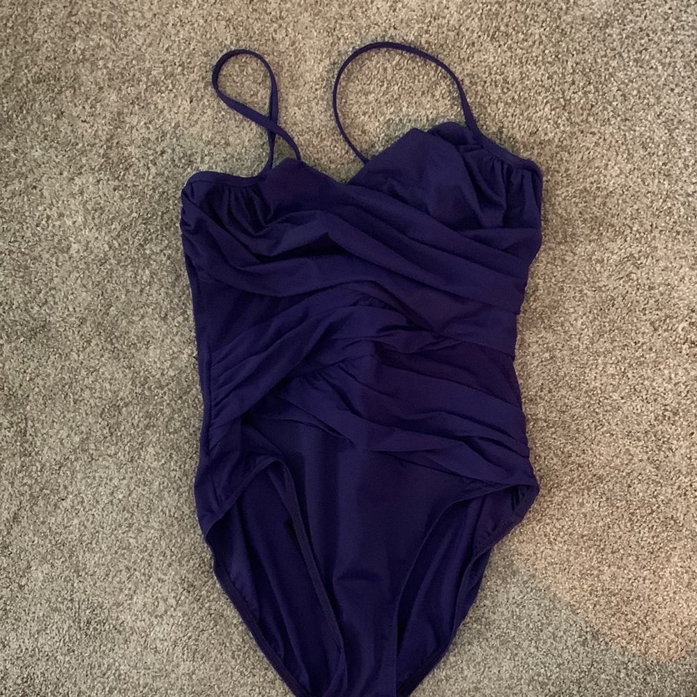 Miraclesuit Women's One Piece Swimsuit in Deep Purple mesh cut out on sides